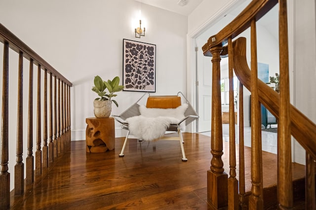 sitting room with dark hardwood / wood-style flooring