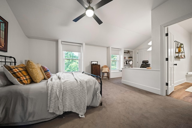 bedroom with lofted ceiling, light carpet, and ceiling fan