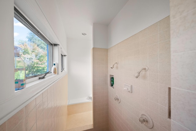 bathroom with tiled shower