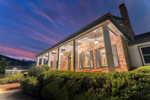 view of property exterior at dusk