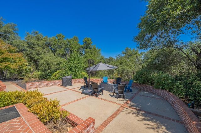 view of patio / terrace with a fire pit