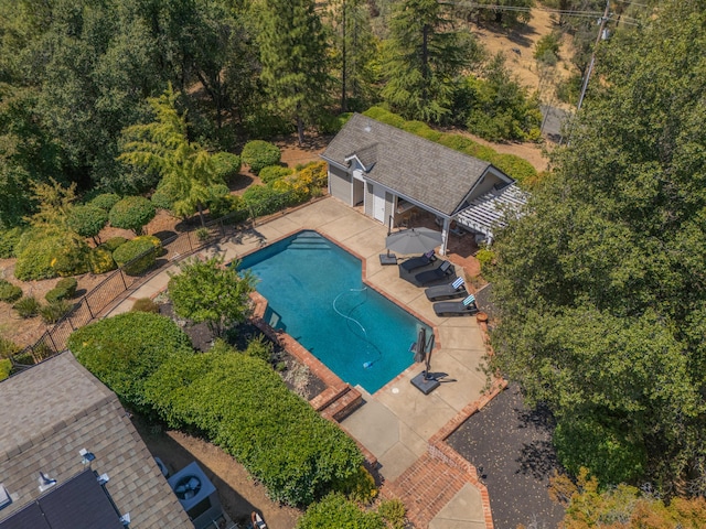 view of pool featuring an outdoor living space, an outbuilding, and a patio