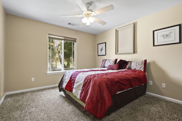 carpeted bedroom featuring visible vents, ceiling fan, and baseboards