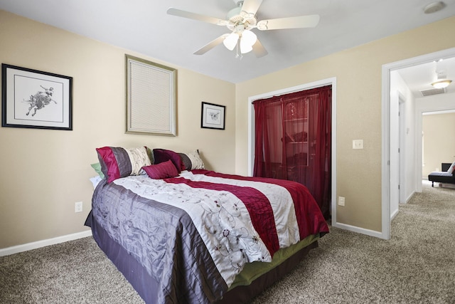 carpeted bedroom featuring visible vents, baseboards, and ceiling fan