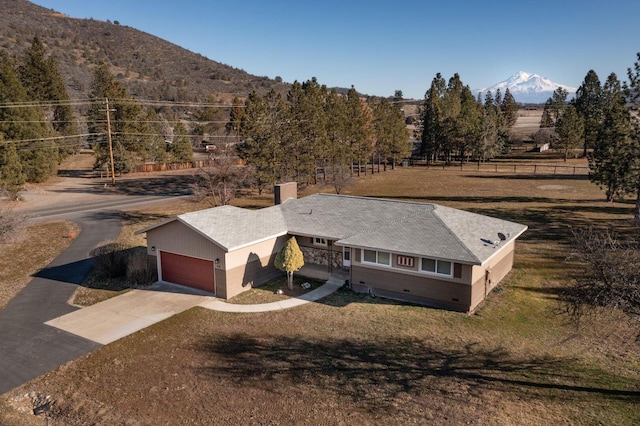 bird's eye view featuring a mountain view and a rural view