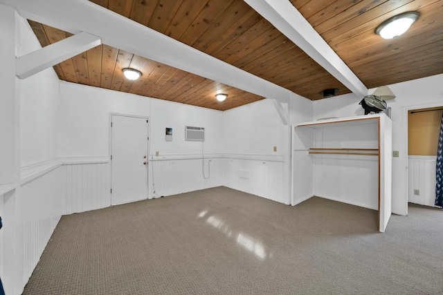 interior space featuring an AC wall unit, wood ceiling, and beam ceiling