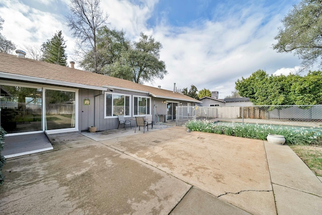 back of property featuring a patio area