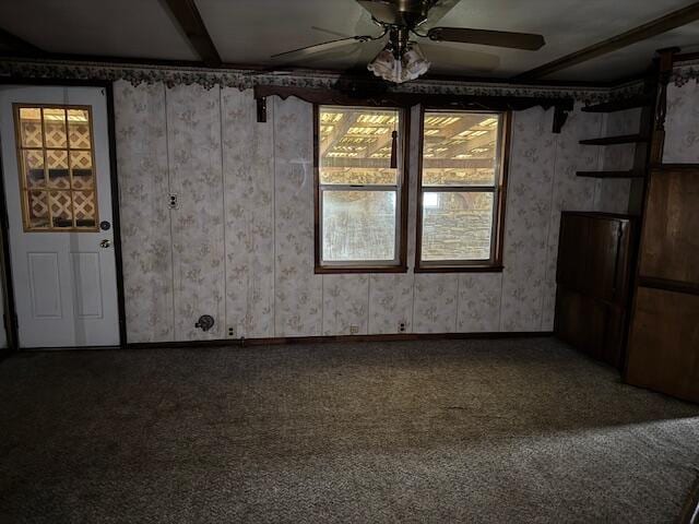 unfurnished room featuring ceiling fan and carpet floors