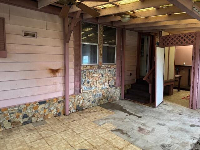 doorway to property with a pergola and a patio area