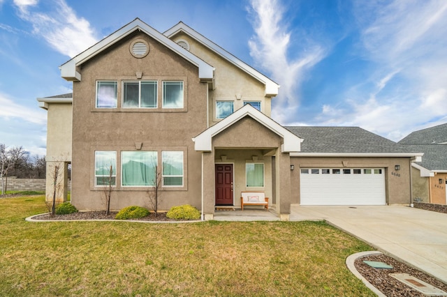 view of front of home featuring a garage and a front yard