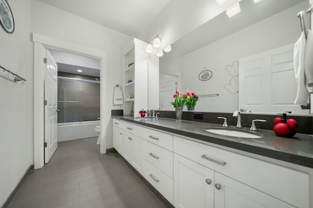 full bathroom with vanity, shower / bath combination with glass door, and toilet