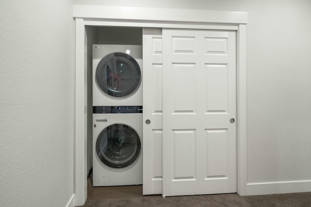 laundry area featuring stacked washer and clothes dryer