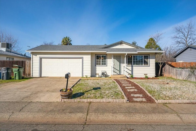 single story home with cooling unit and a garage