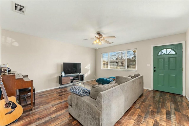 living room with ceiling fan and dark hardwood / wood-style flooring