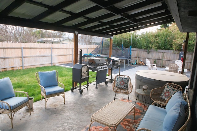 view of patio / terrace with area for grilling, an outdoor living space, and a trampoline