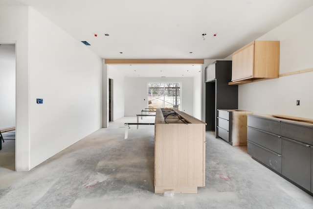 kitchen featuring light brown cabinets