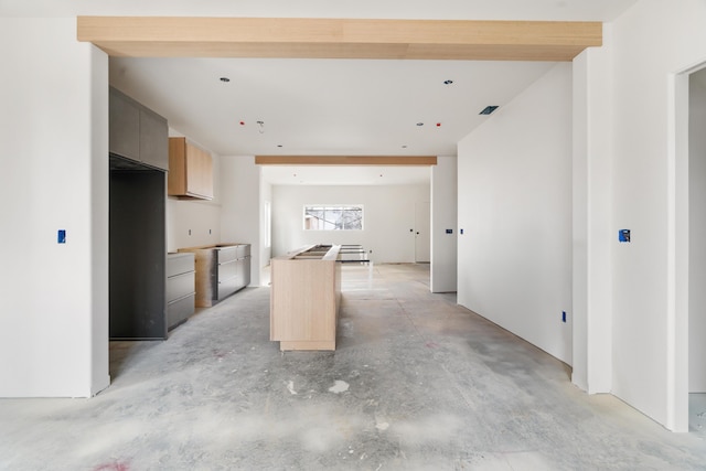 kitchen featuring a center island and light brown cabinetry