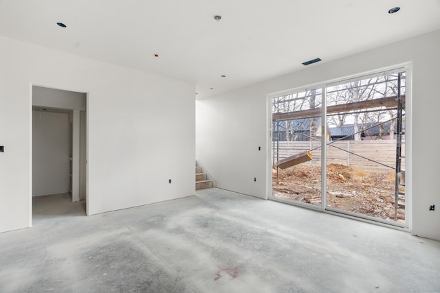 spare room with concrete floors