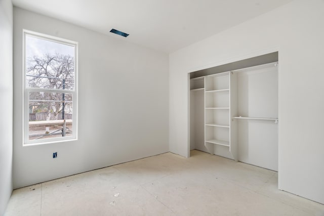 unfurnished bedroom with a closet