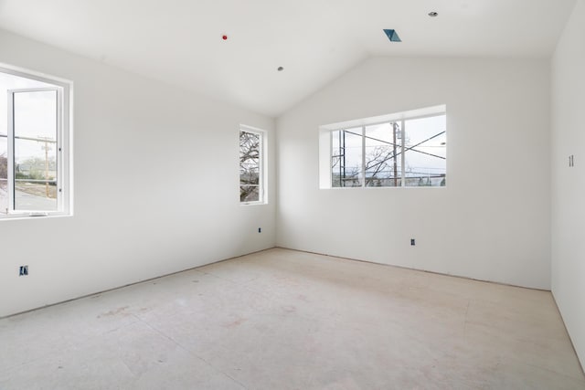 empty room featuring lofted ceiling