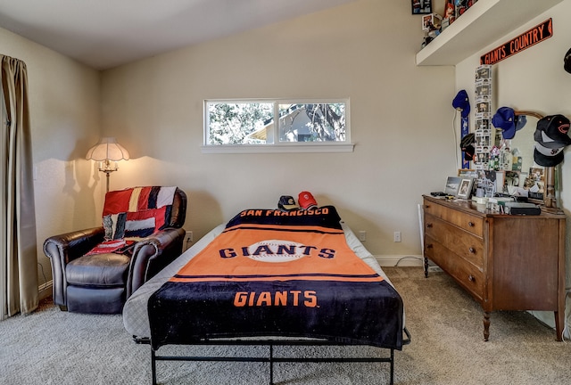 bedroom featuring vaulted ceiling and carpet floors