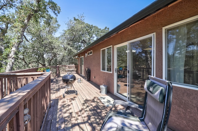 wooden terrace with grilling area