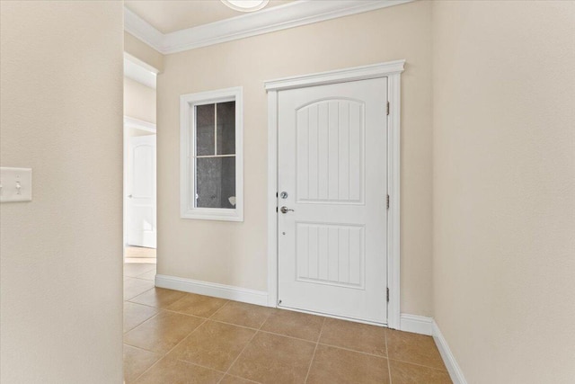 tiled entryway featuring ornamental molding