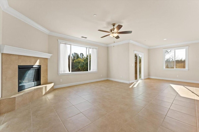 unfurnished living room featuring light tile patterned floors, crown molding, a premium fireplace, and ceiling fan