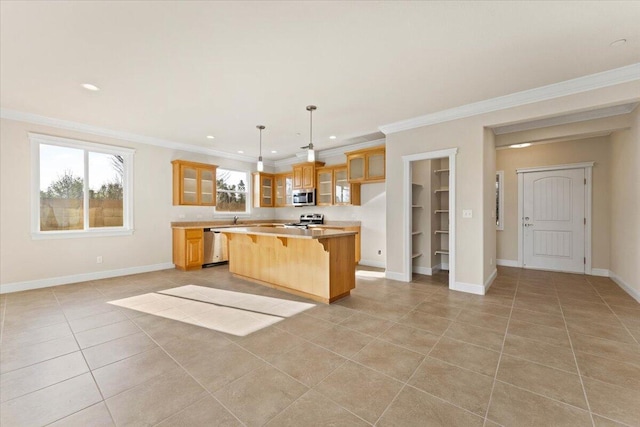 kitchen featuring appliances with stainless steel finishes, decorative light fixtures, a breakfast bar area, a center island, and light tile patterned floors