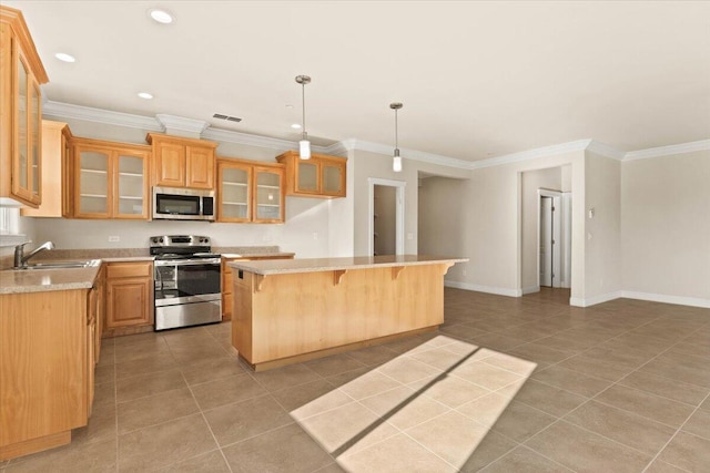 kitchen featuring stainless steel appliances, decorative light fixtures, sink, and light tile patterned floors