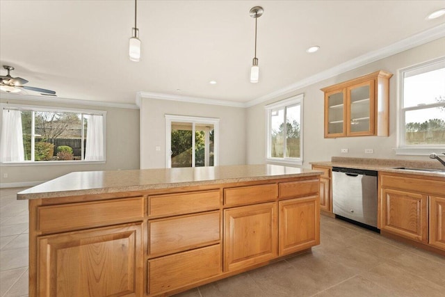 kitchen featuring dishwasher, sink, pendant lighting, and a wealth of natural light