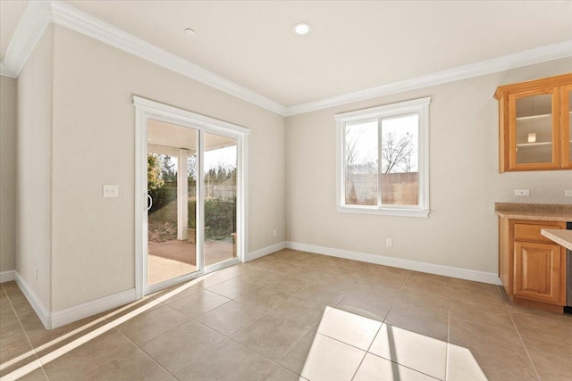 unfurnished dining area with crown molding and light tile patterned floors