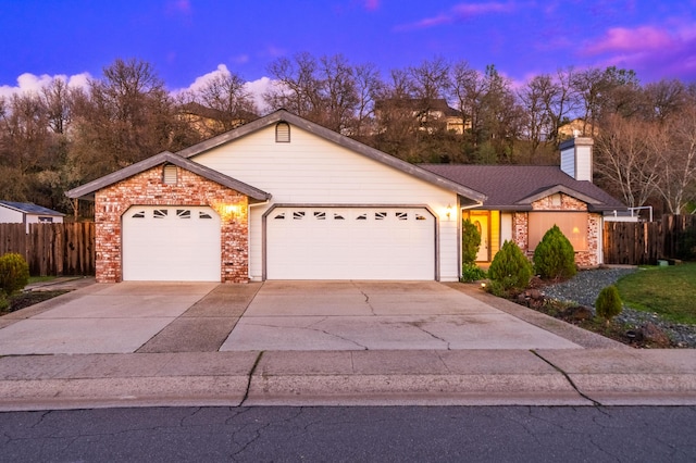 ranch-style home featuring a garage