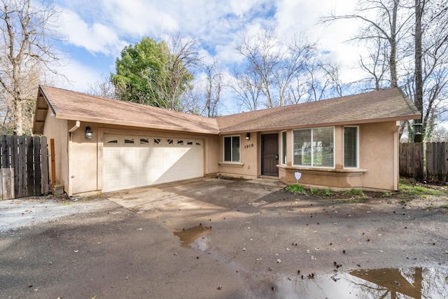 single story home featuring a garage