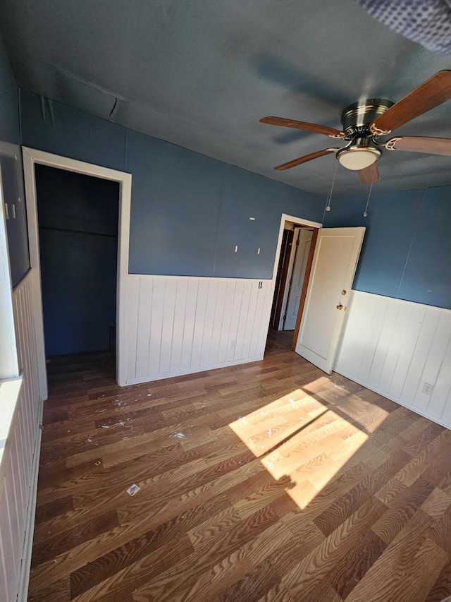 spare room featuring ceiling fan and hardwood / wood-style floors