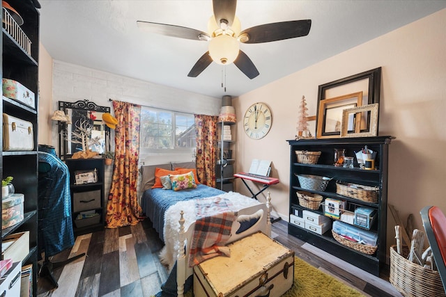 bedroom with dark wood-type flooring and ceiling fan