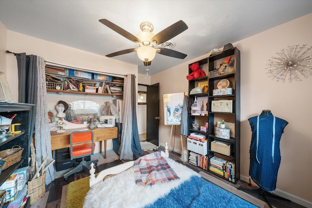 bedroom with hardwood / wood-style flooring and ceiling fan