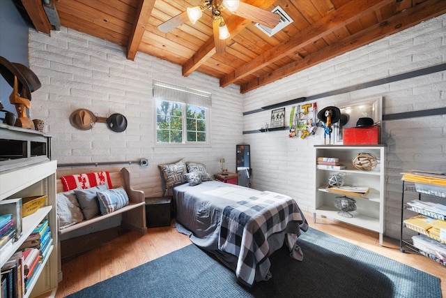 bedroom with hardwood / wood-style flooring, brick wall, wood ceiling, and beamed ceiling