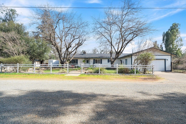 ranch-style home featuring a garage