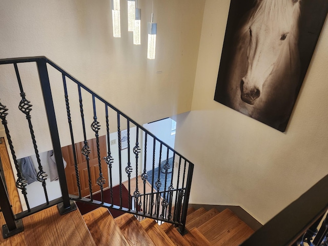 stairway featuring hardwood / wood-style floors