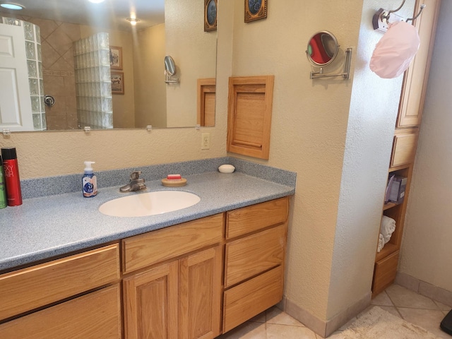 bathroom with vanity, tile patterned floors, and walk in shower