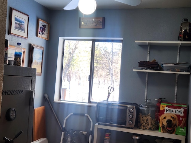 laundry area with ceiling fan