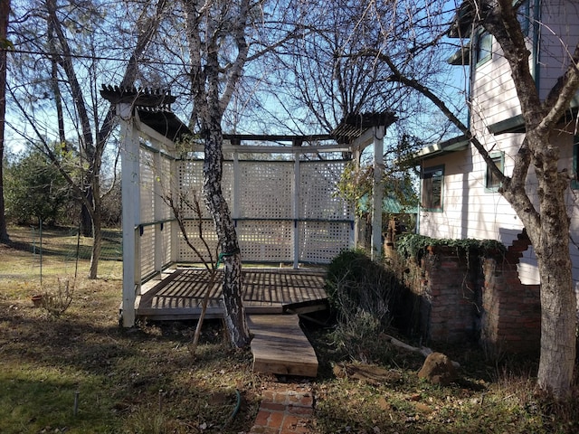 rear view of property featuring a deck