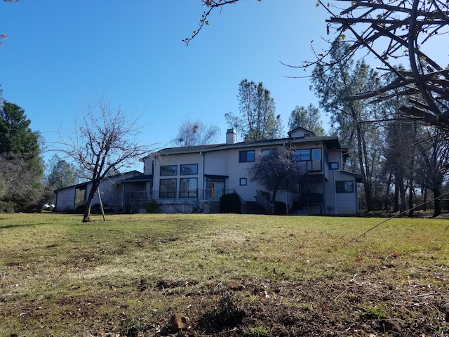 back of house with a yard