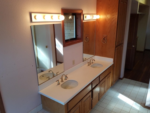 bathroom with vanity and tile patterned floors