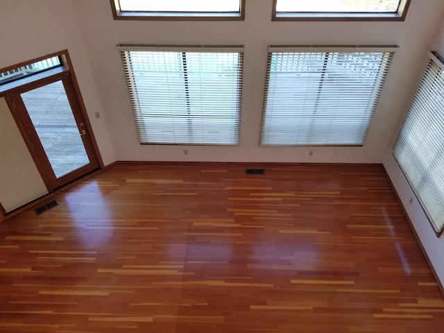 empty room featuring dark hardwood / wood-style flooring