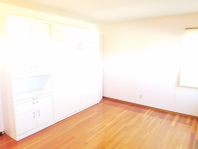 unfurnished bedroom with light hardwood / wood-style flooring