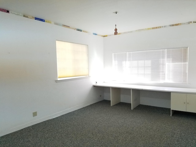 unfurnished office with dark carpet