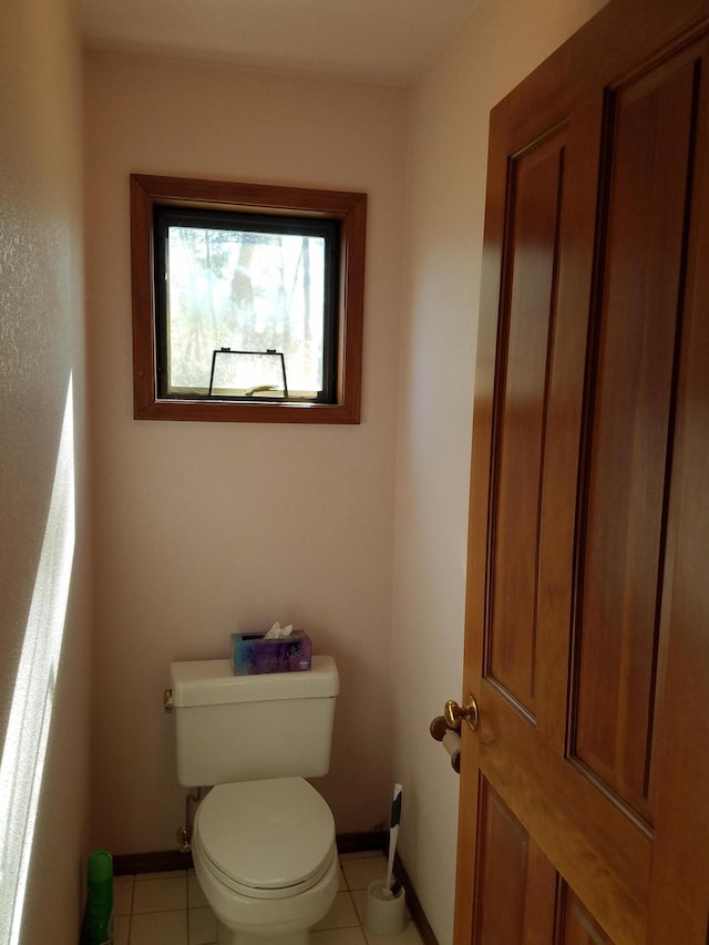 bathroom featuring tile patterned flooring and toilet