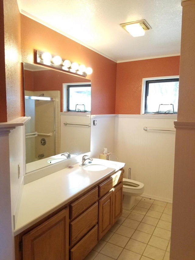 full bathroom featuring vanity, tile patterned flooring, toilet, and a healthy amount of sunlight